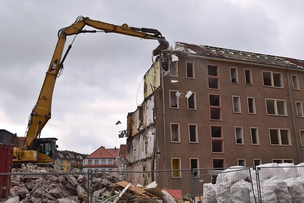 demolition of a building causing construction and demolition waste, which ends up in landfill.