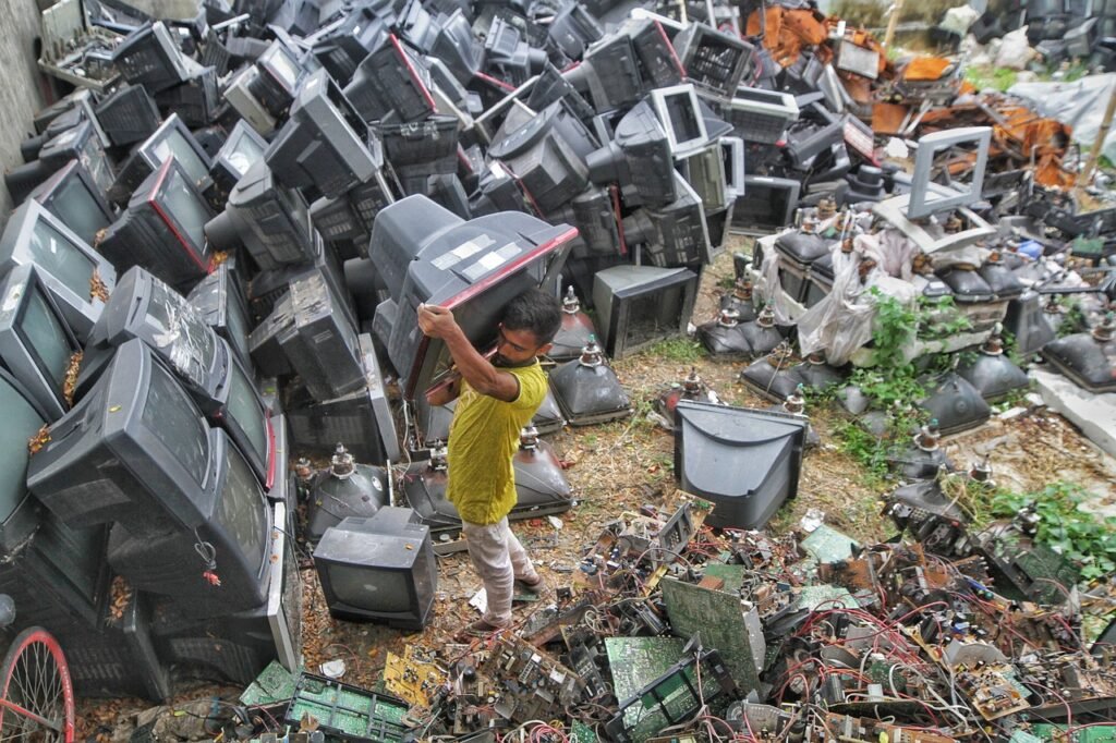 Used TVs dumped in a developing country to be sorted unethically, causing human harm and environmental pollution.